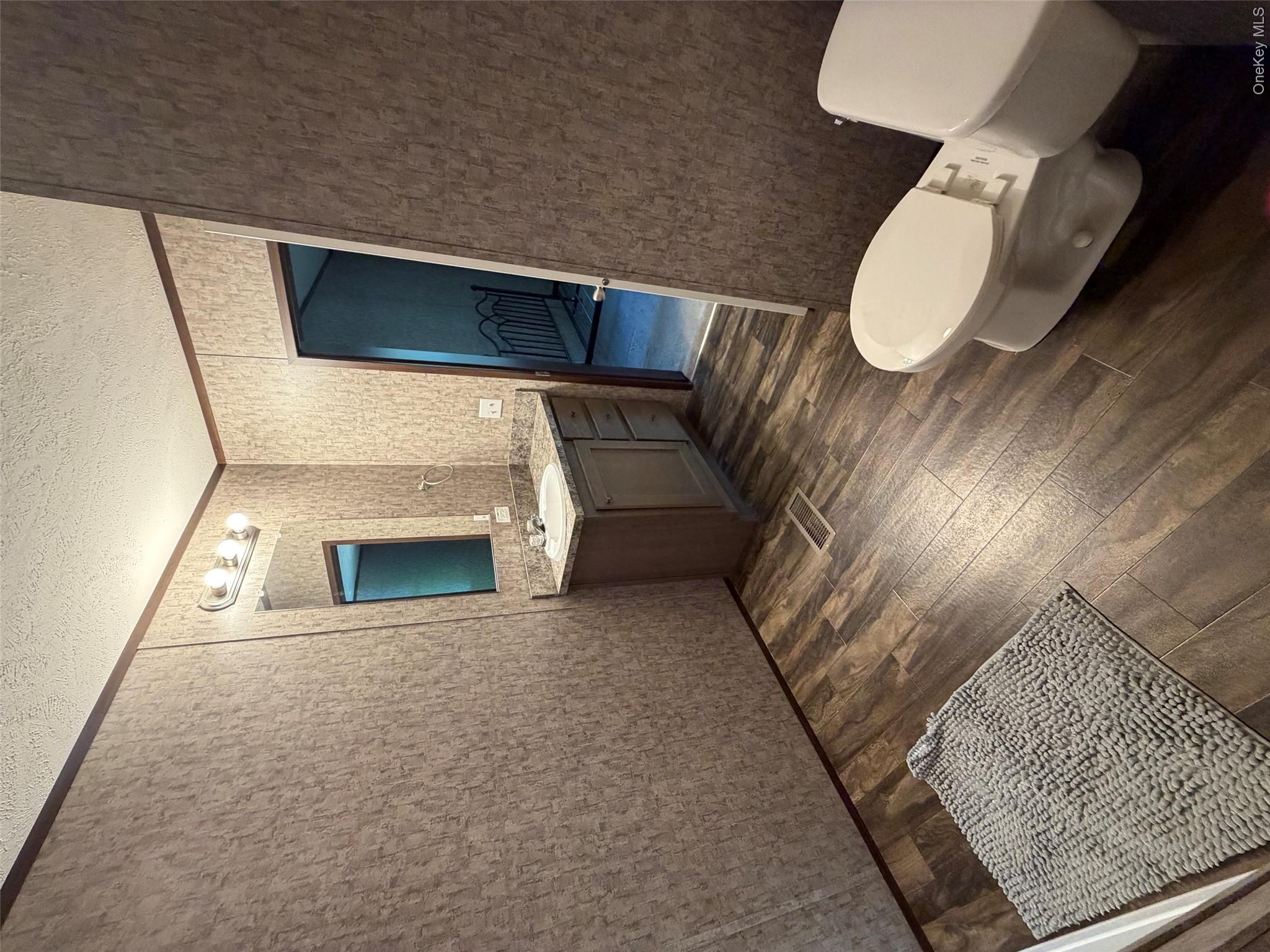 655 Samsonville Road Kerhonkson, NY 12446 - Photo 11 of 11 a bathroom with a sink and mirror