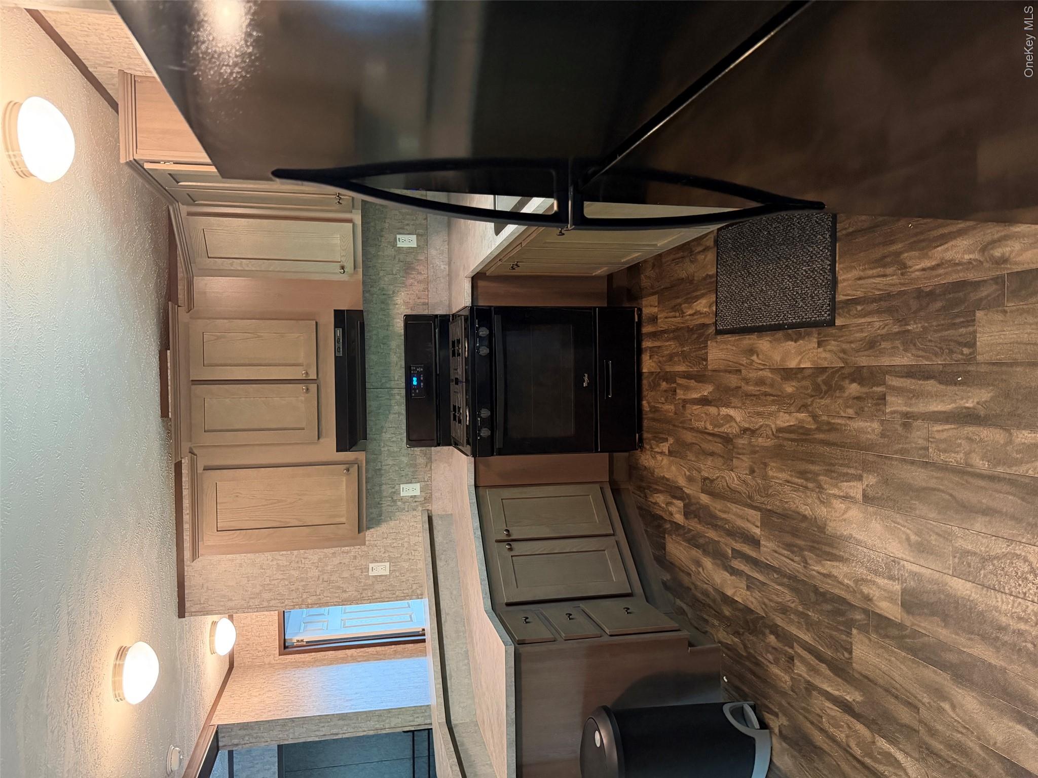 655 Samsonville Road Kerhonkson, NY 12446 - Photo 4 of 11 a kitchen with granite countertop a stove a sink and a refrigerator