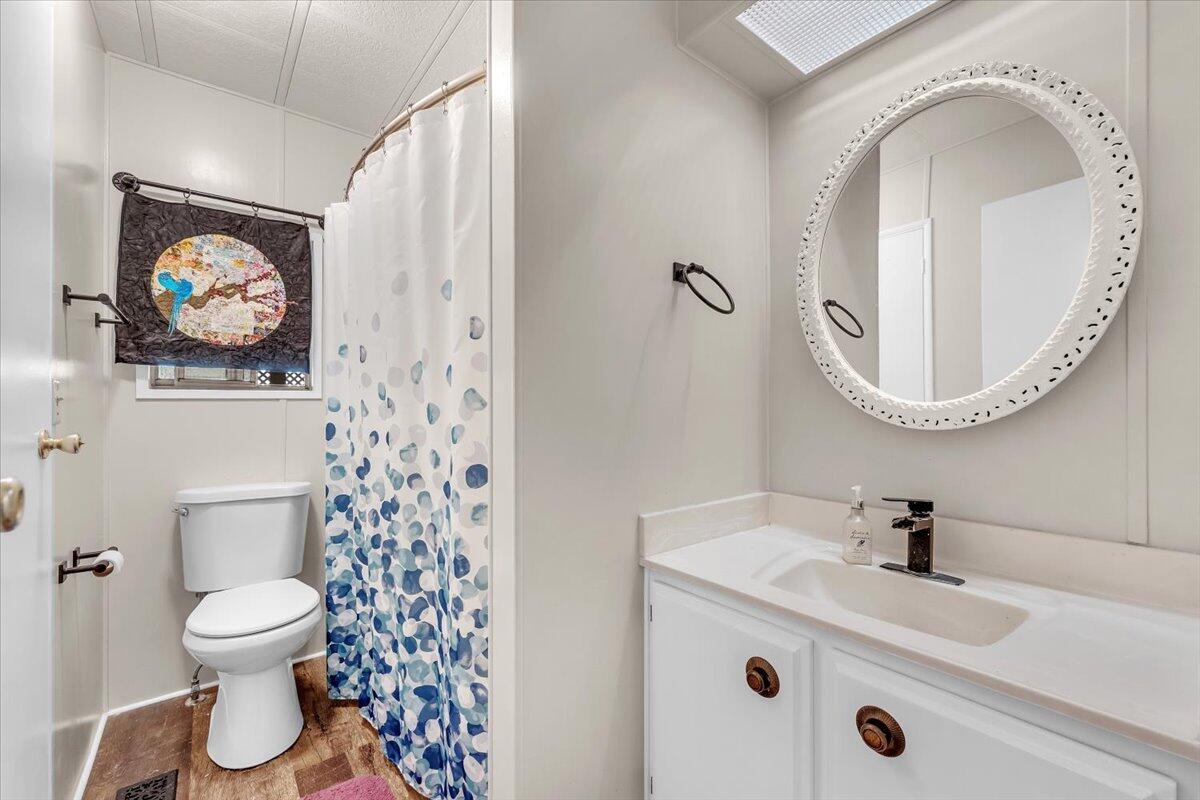 350 Gilmore Road, Unit SPC 16 Red Bluff, CA 96080 - Photo 27 of 35 a bathroom with a sink and a mirror