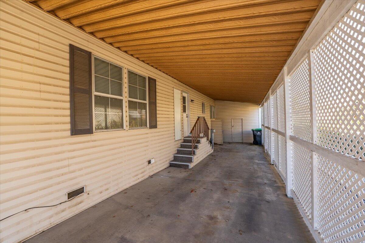 350 Gilmore Road, Unit SPC 16 Red Bluff, CA 96080 - Photo 30 of 35 a view of a staircase with wooden walls and stairs