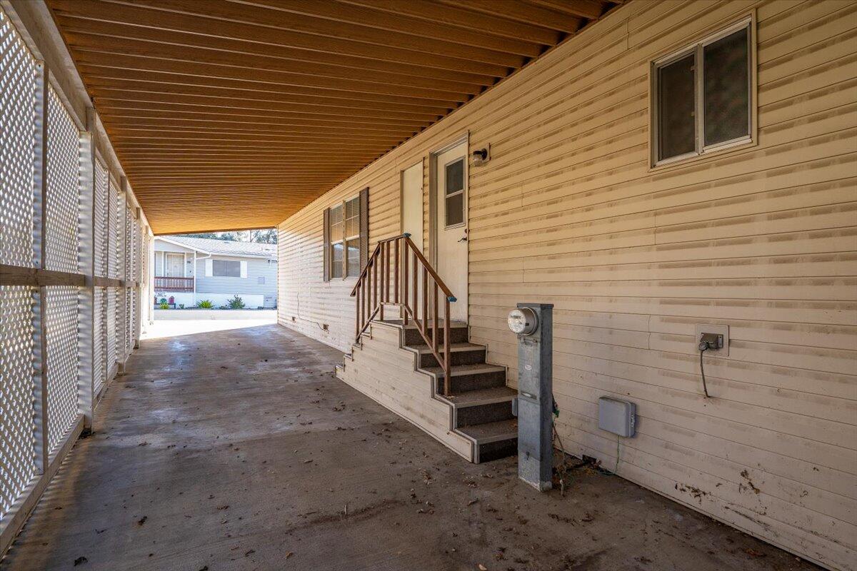 350 Gilmore Road, Unit SPC 16 Red Bluff, CA 96080 - Photo 32 of 35 a view of a porch with wooden stairs