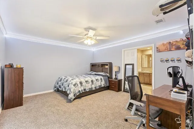 a bedroom with a bed and a table