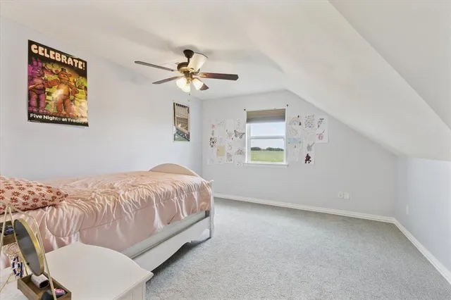 a bed room with a bed and a window