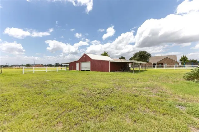 a view of a house with a big yard