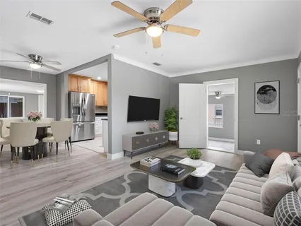 a living room with furniture and a flat screen tv