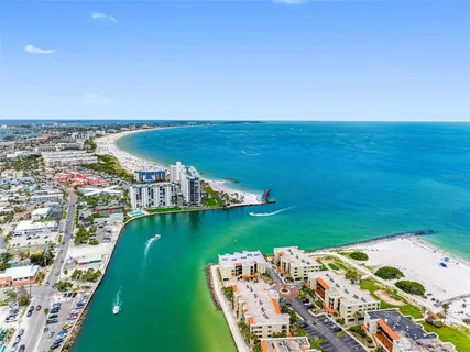 a multi story building with palm trees