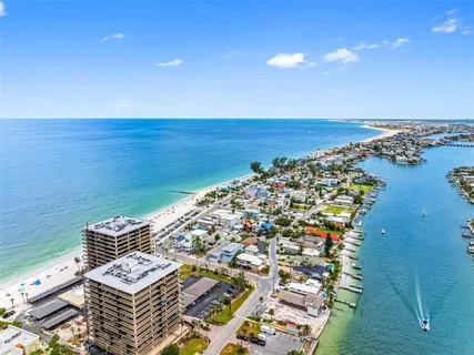 a view of a lake with houses in the back