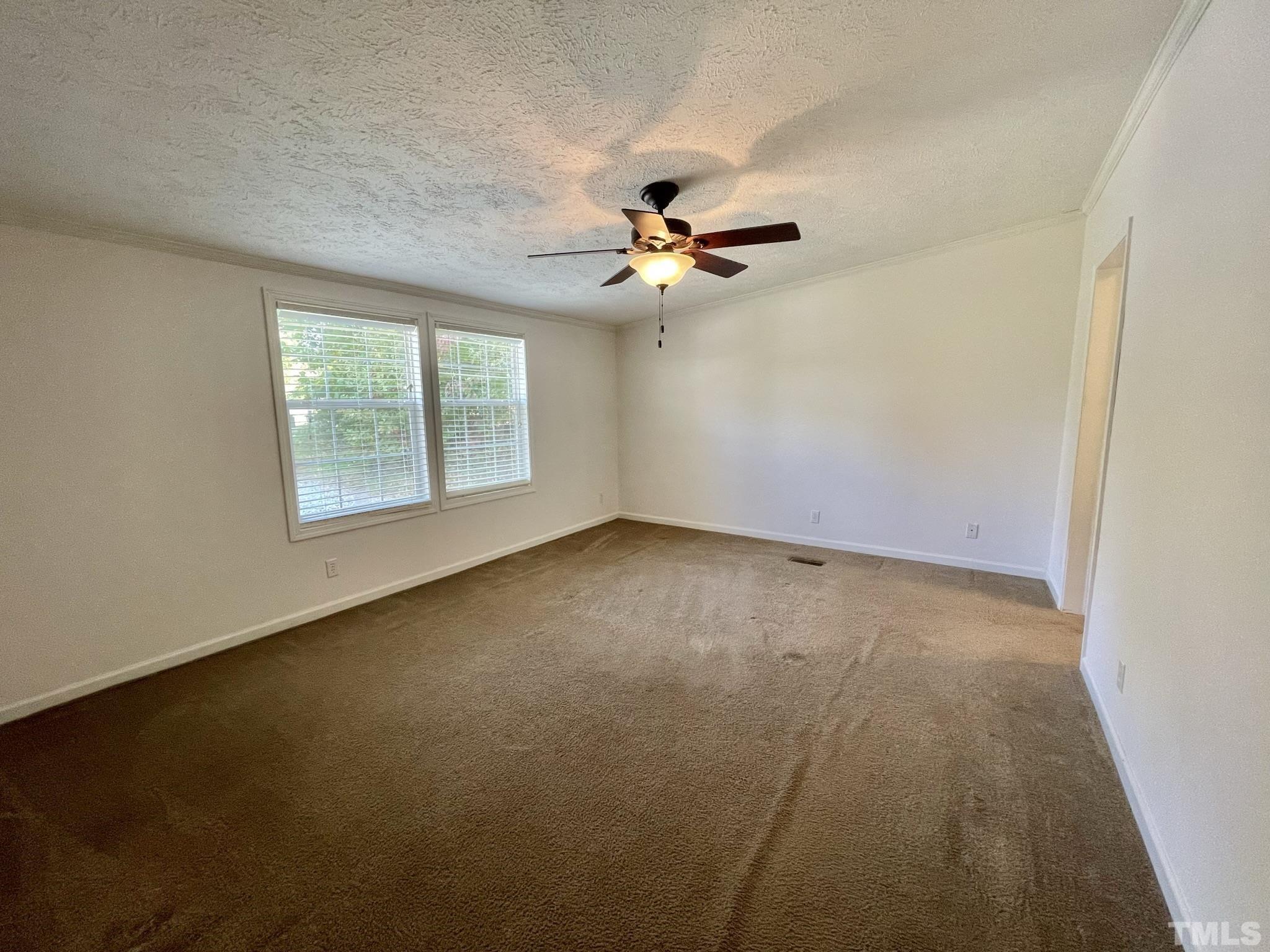 45 Divine Lane Roxboro, NC 27573 - Photo 12 of 28 an empty room with windows and fan