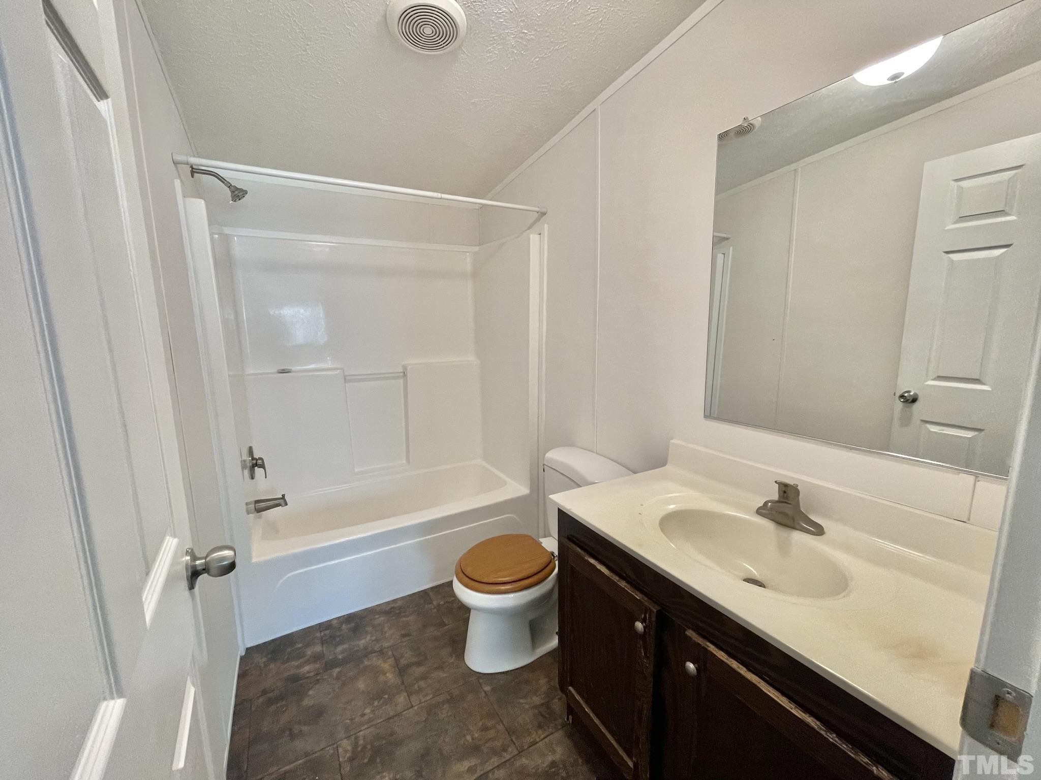 45 Divine Lane Roxboro, NC 27573 - Photo 20 of 28 a bathroom with a sink a toilet and shower