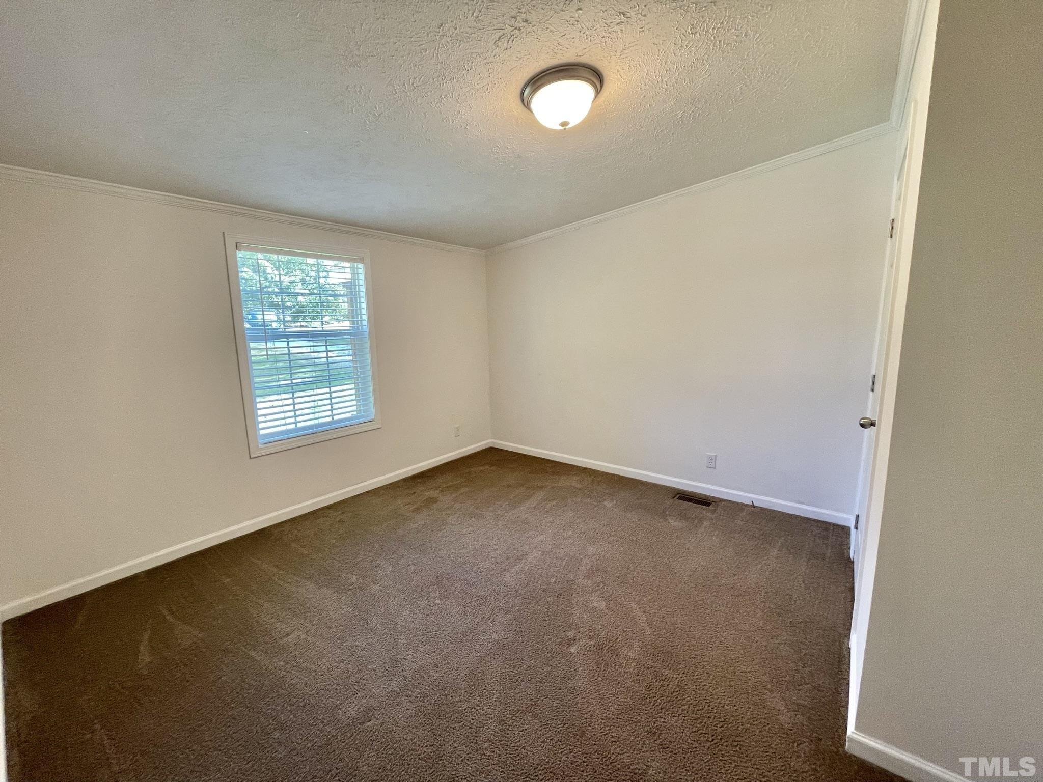 45 Divine Lane Roxboro, NC 27573 - Photo 21 of 28 an empty room with windows