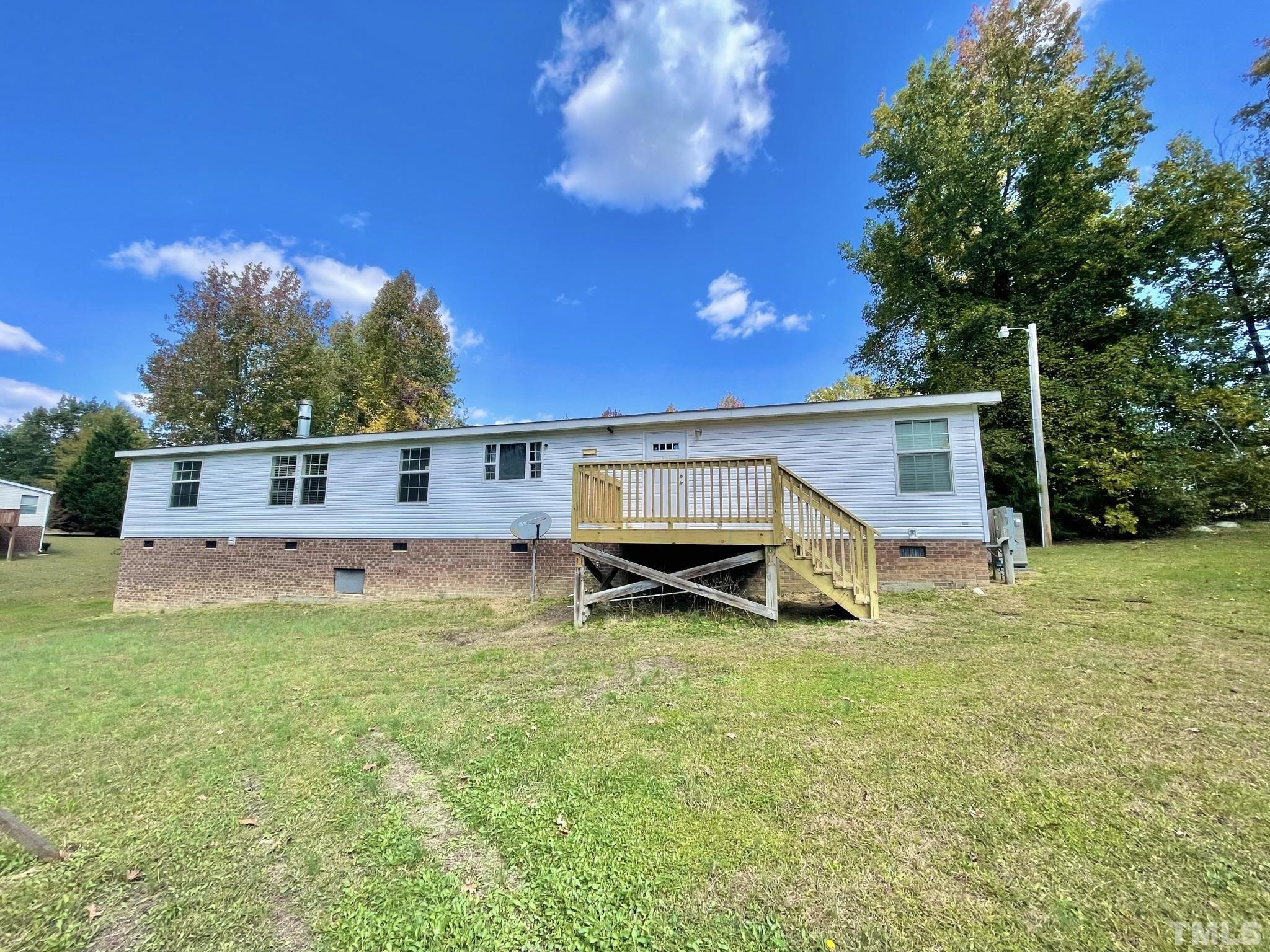 45 Divine Lane Roxboro, NC 27573 - Photo 26 of 28 a view of a house with a yard balcony and sitting area