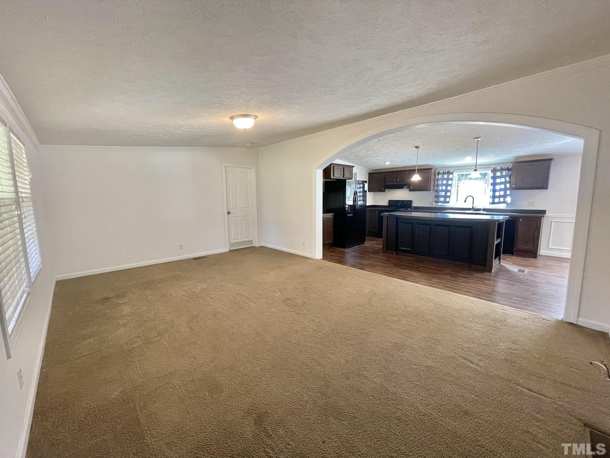 45 Divine Lane Roxboro, NC 27573 - Photo 5 of 28 a living room with a large window