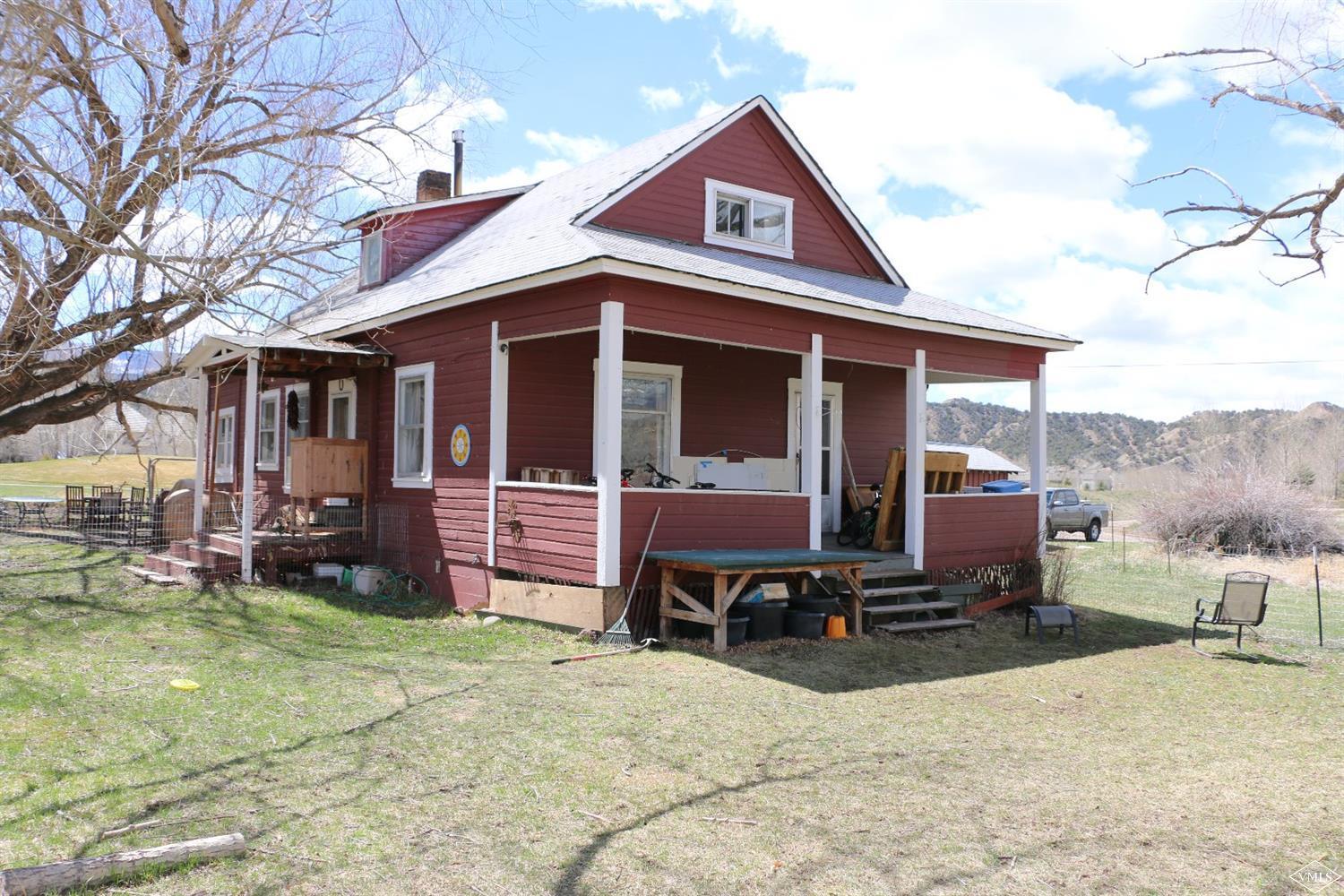 1500 Sylvan Lake Road Eagle, CO 81631 - Photo 1 of 10 a view of a house with a yard patio and fire pit