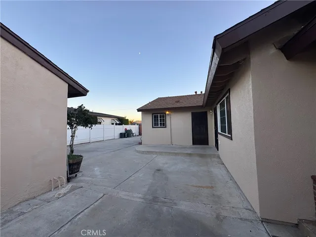 a view of a house with a backyard and windows