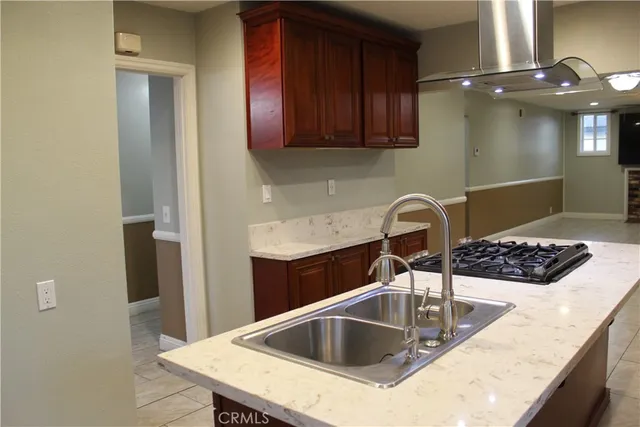 a kitchen with a sink cabinets and stainless steel appliances