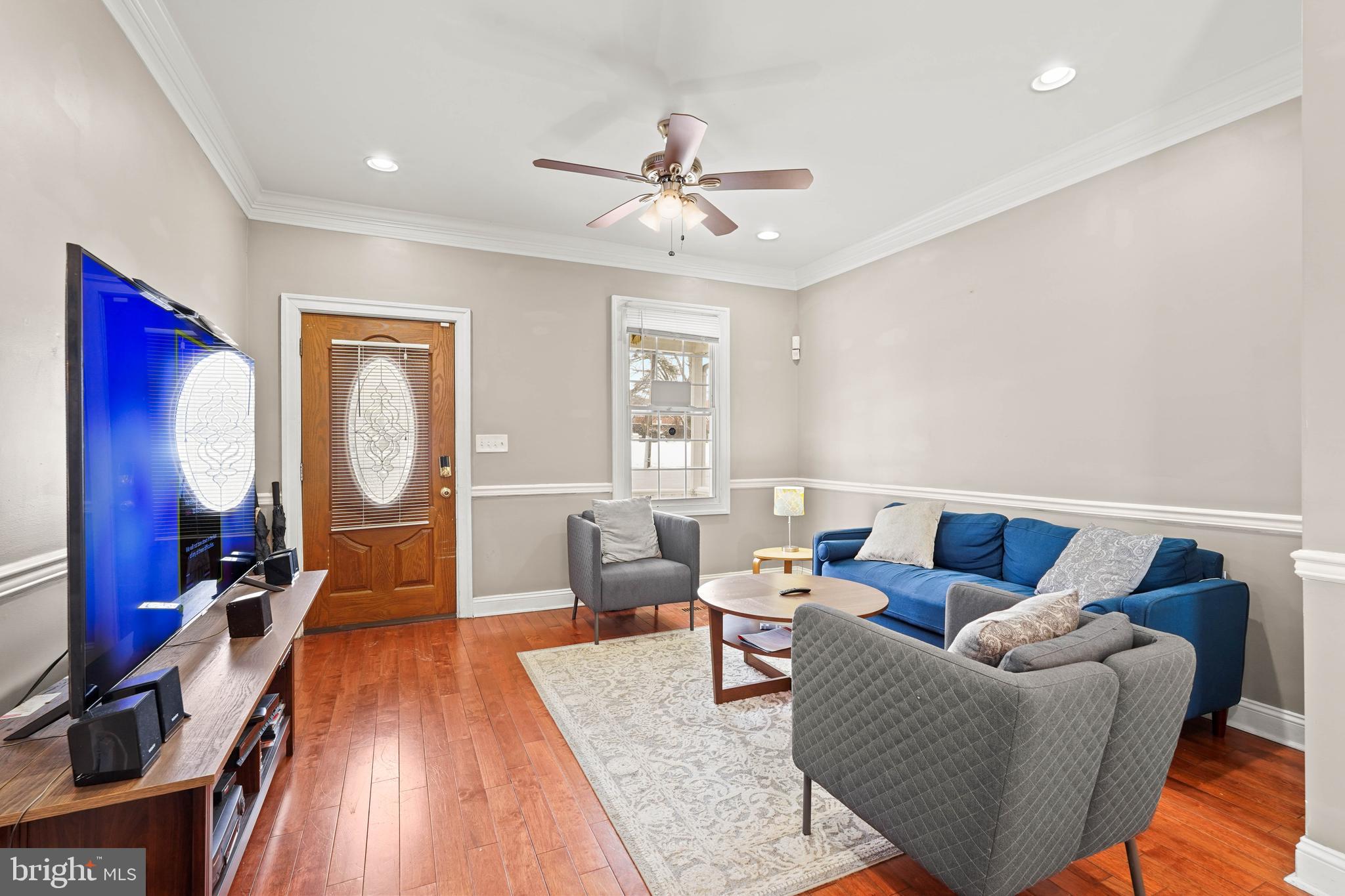 5013 The Alameda Baltimore, MD 21239 - Photo 2 of 24 a living room with furniture and a flat screen tv