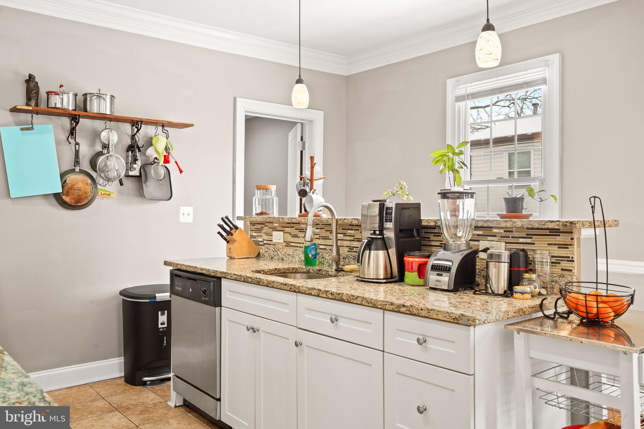 5013 The Alameda Baltimore, MD 21239 - Photo 6 of 24 a kitchen with stainless steel appliances granite countertop a sink and a stove