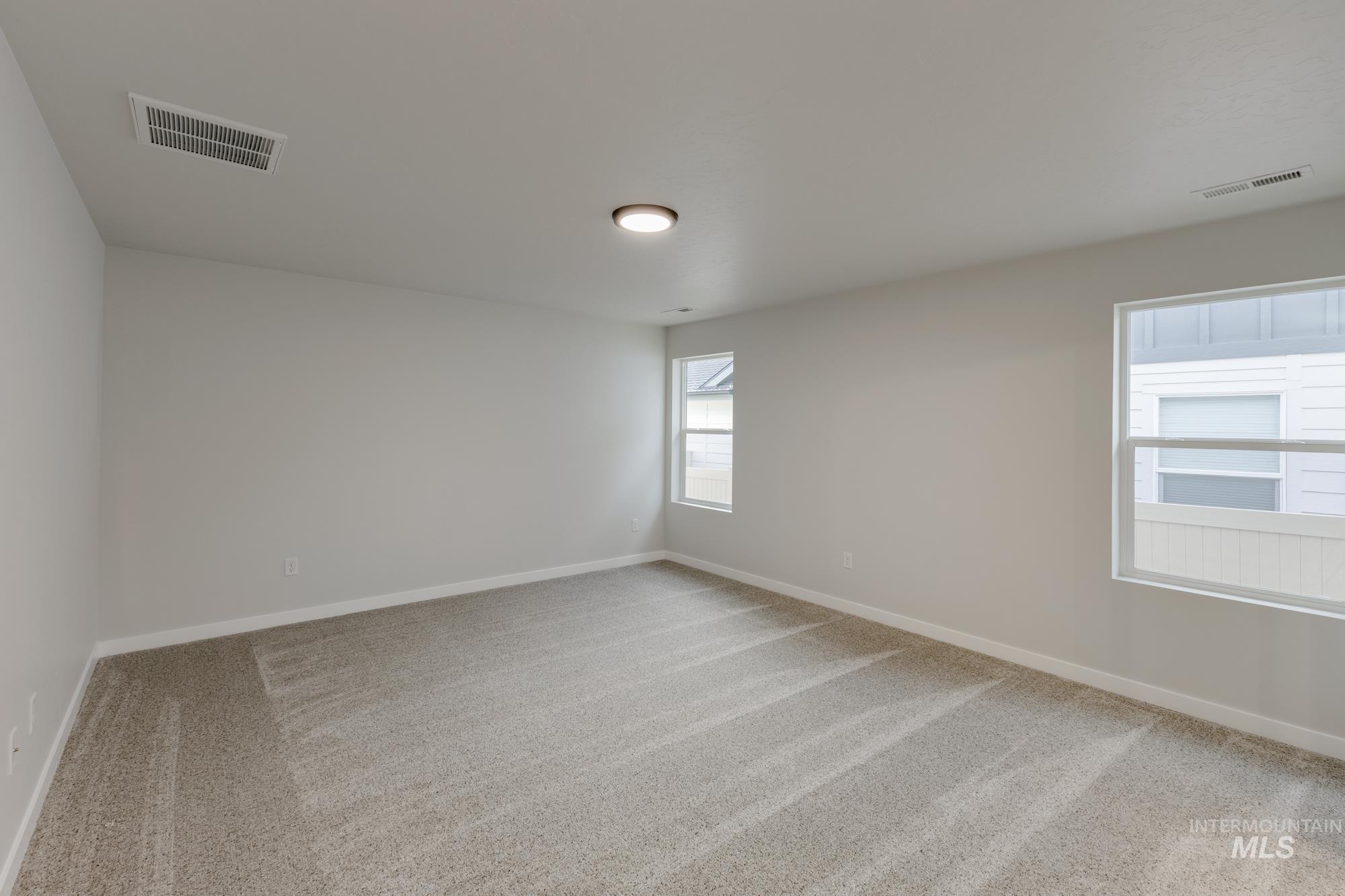1716 North Birch Street Jerome, ID 83338 - Photo 13 of 16 Spare room with light colored carpet and baseboards