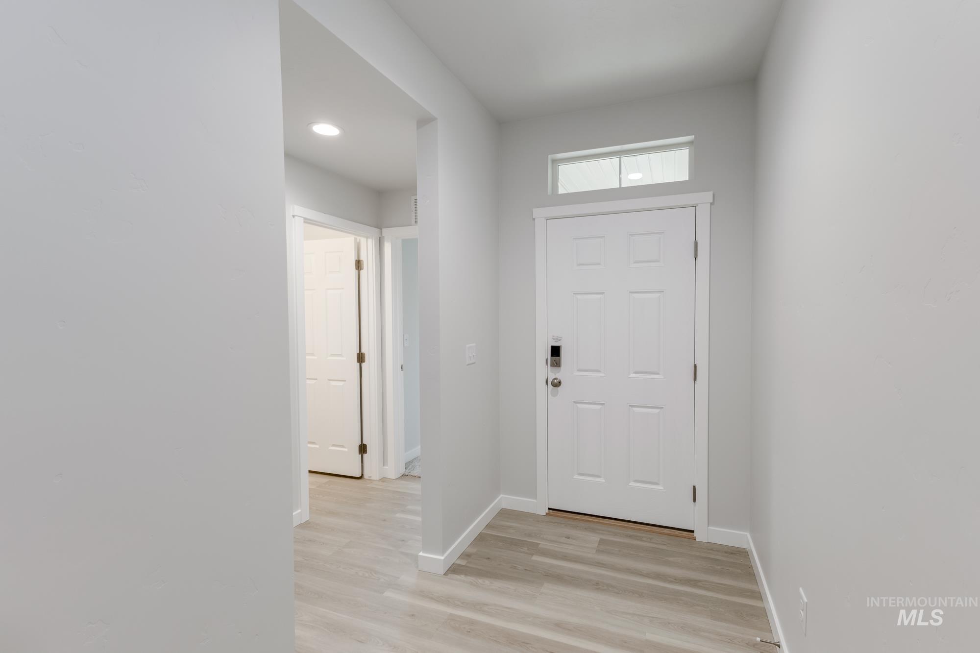 1716 North Birch Street Jerome, ID 83338 - Photo 2 of 16 Foyer entrance with baseboards and light wood-style flooring