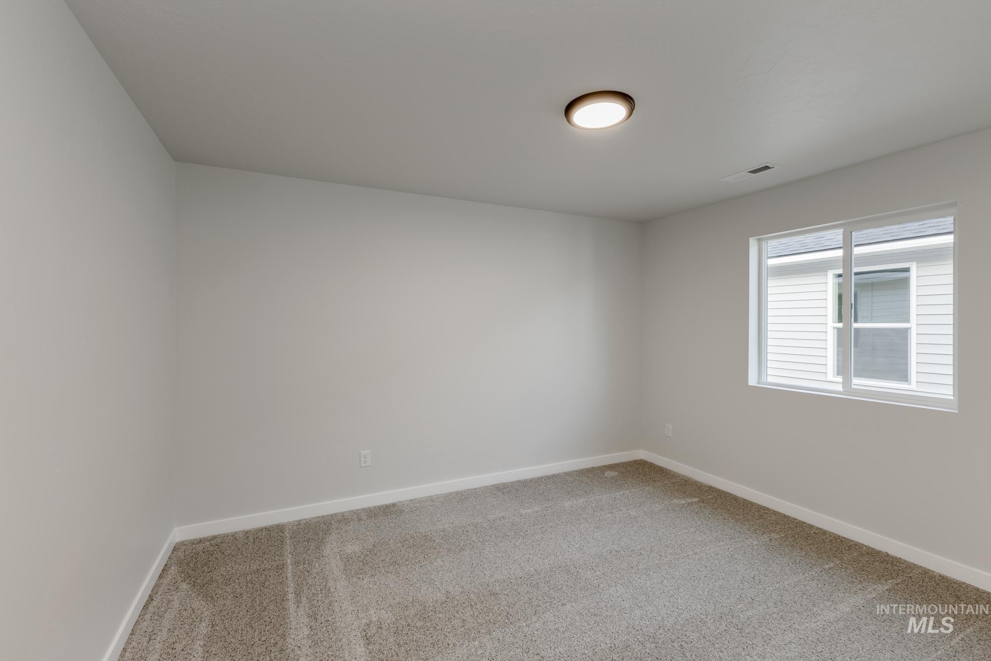 1716 North Birch Street Jerome, ID 83338 - Photo 10 of 16 Spare room with light colored carpet and baseboards