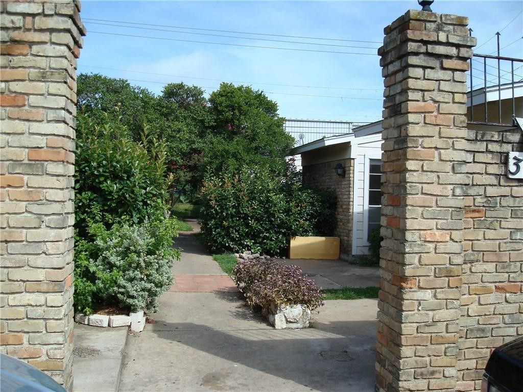 a backyard of a house with outdoor seating