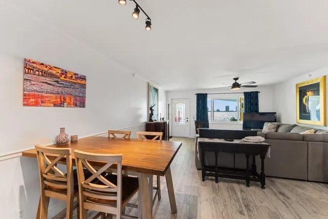 a bathroom with a granite countertop sink mirror vanity and toilet