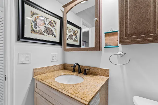 a bedroom with a bed a window and a flat screen tv