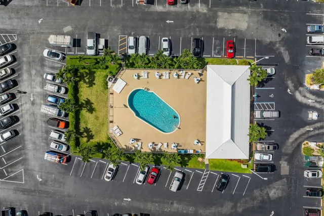 a view of a swimming pool with a yard