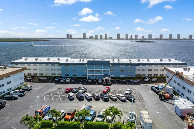 a aerial view of a house with a garden and outdoor seating