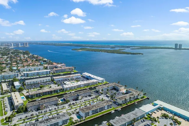 an aerial view of a house with a ocean view