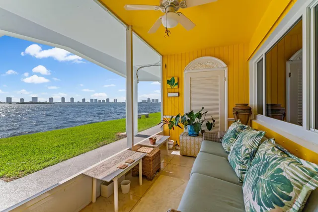 a view of swimming pool with outdoor seating and plants