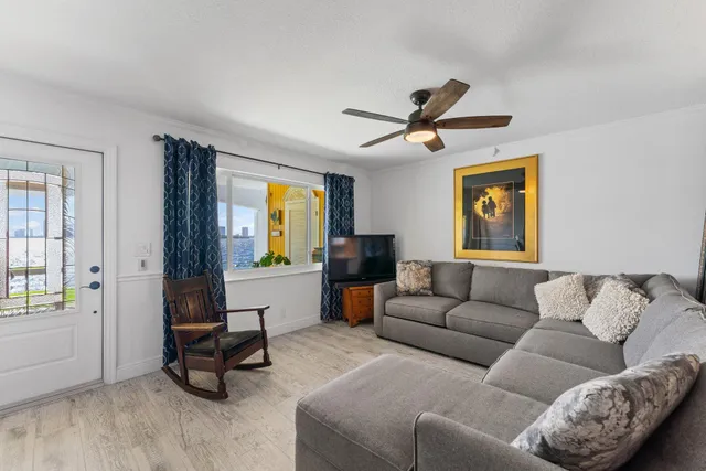 a living room with furniture and a window