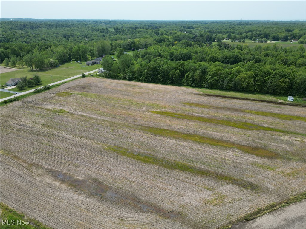 0 Creek Road Conneaut, OH 44030 - Photo 1 of 5 Aerial view of sparsely populated area featuring a heavily wooded area