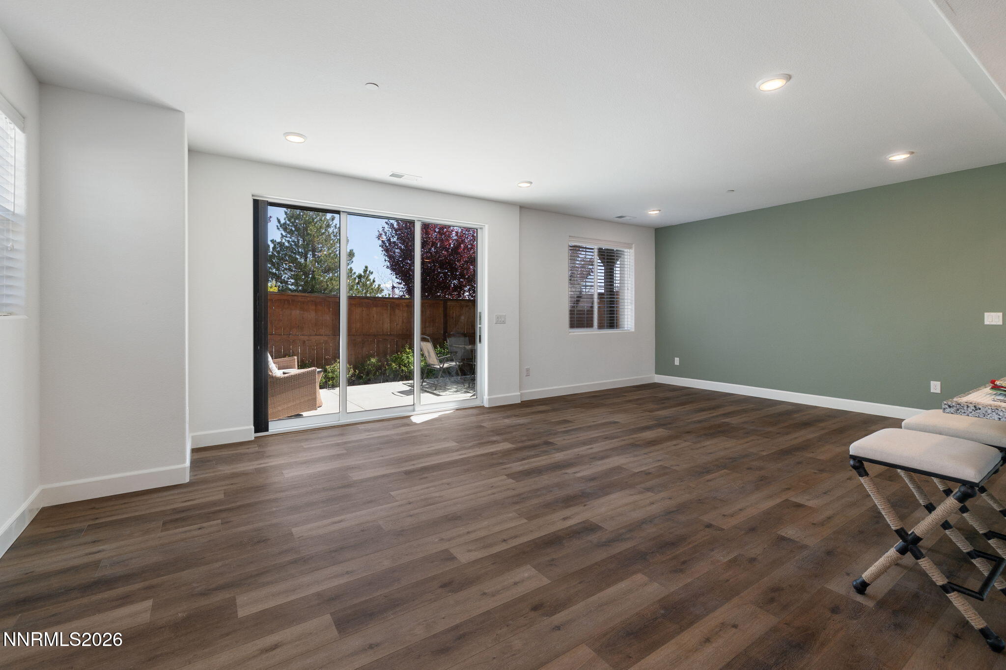 2010 Cradle Mountain Drive, Unit 3 Reno, NV 89523 - Photo 11 of 31 a view of an empty room with wooden floor and glass door