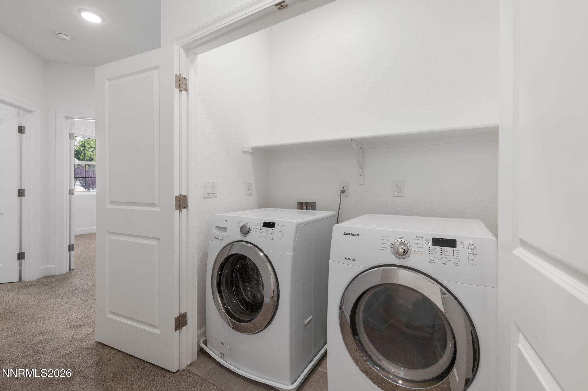 2010 Cradle Mountain Drive, Unit 3 Reno, NV 89523 - Photo 13 of 31 a utility room with dryer and washer