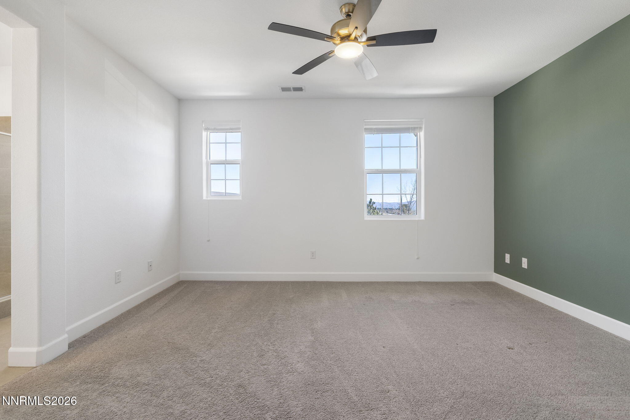 2010 Cradle Mountain Drive, Unit 3 Reno, NV 89523 - Photo 14 of 31 an empty room with a window and a fan