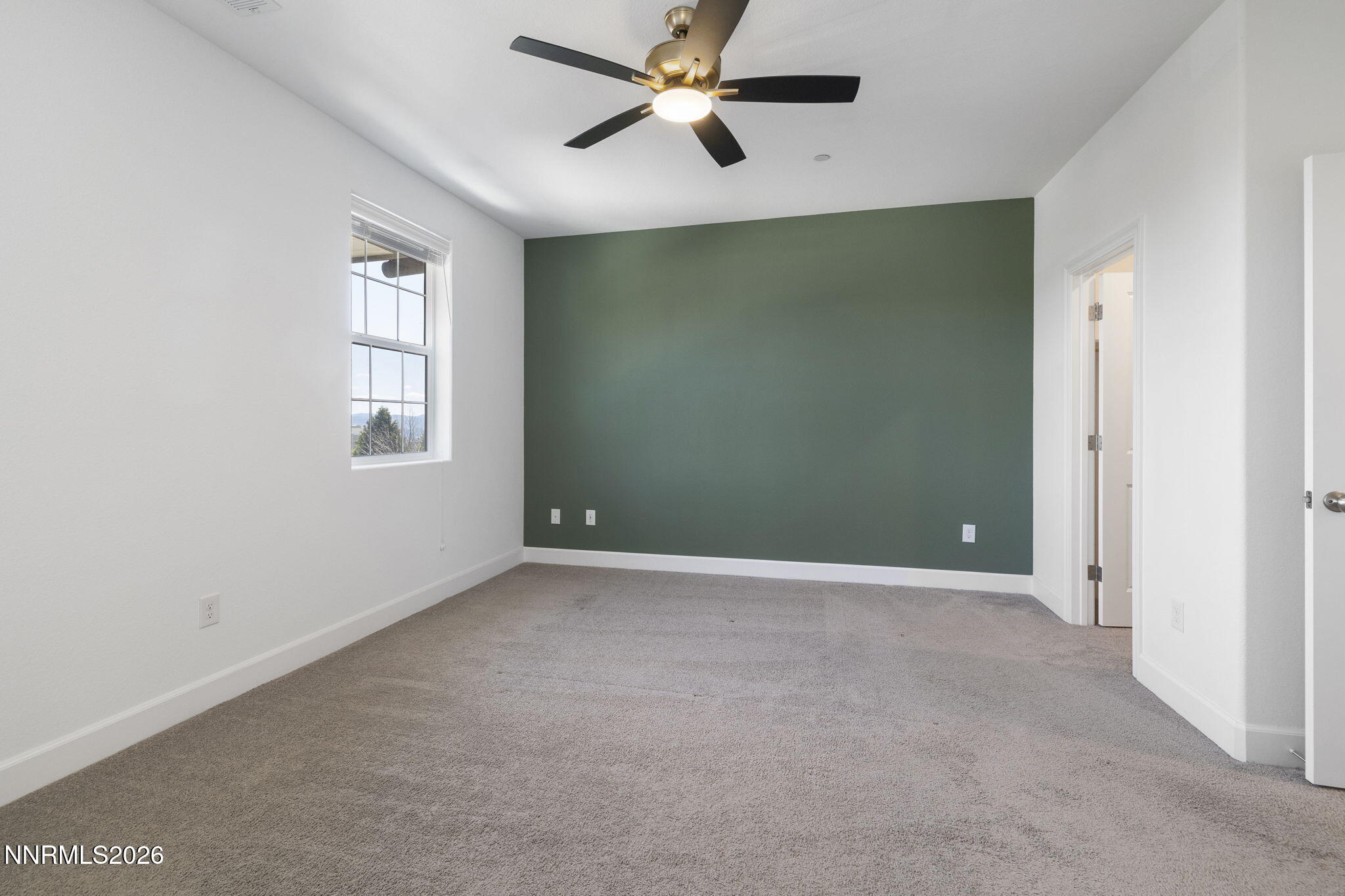 2010 Cradle Mountain Drive, Unit 3 Reno, NV 89523 - Photo 17 of 31 an empty room with windows and fan