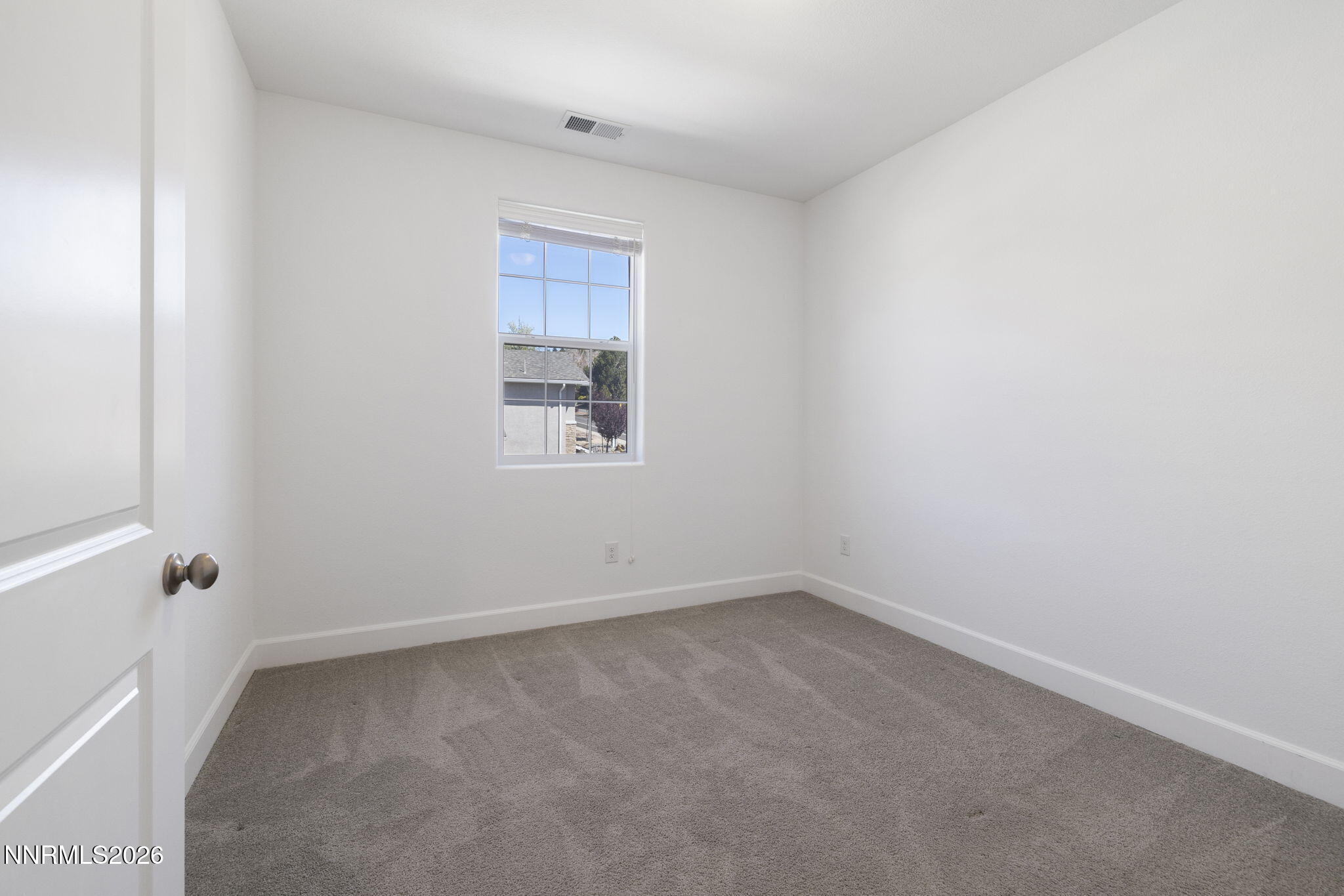2010 Cradle Mountain Drive, Unit 3 Reno, NV 89523 - Photo 20 of 31 an empty room with a window