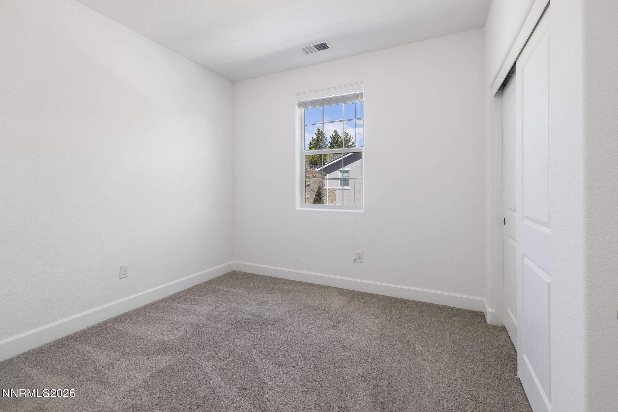 2010 Cradle Mountain Drive, Unit 3 Reno, NV 89523 - Photo 22 of 31 an empty room with windows