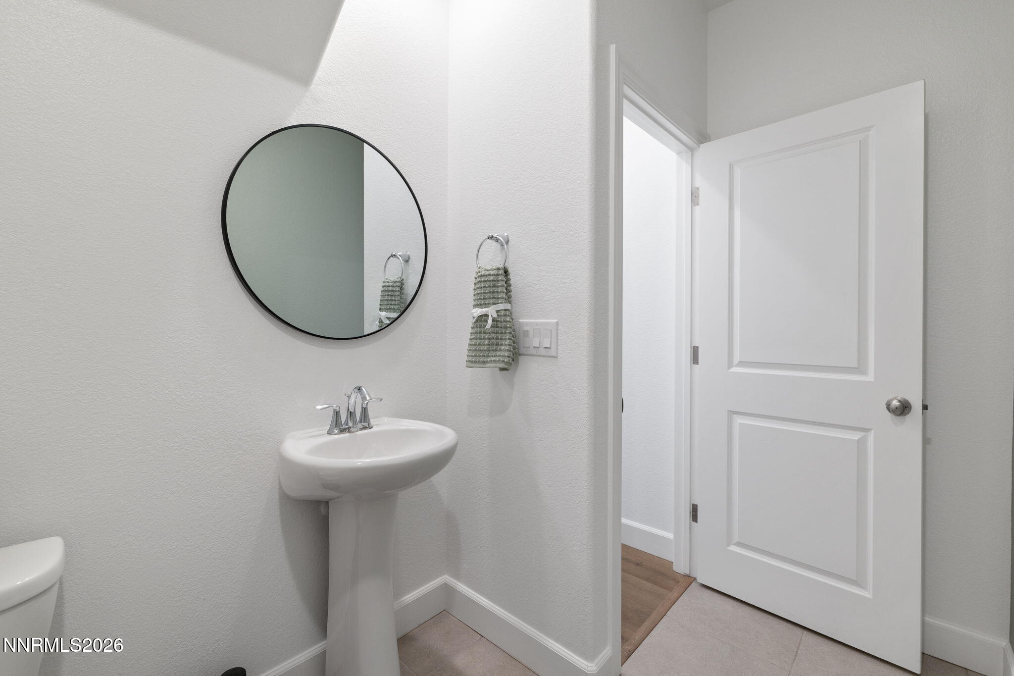 2010 Cradle Mountain Drive, Unit 3 Reno, NV 89523 - Photo 27 of 31 a bathroom with a sink mirror and toilet