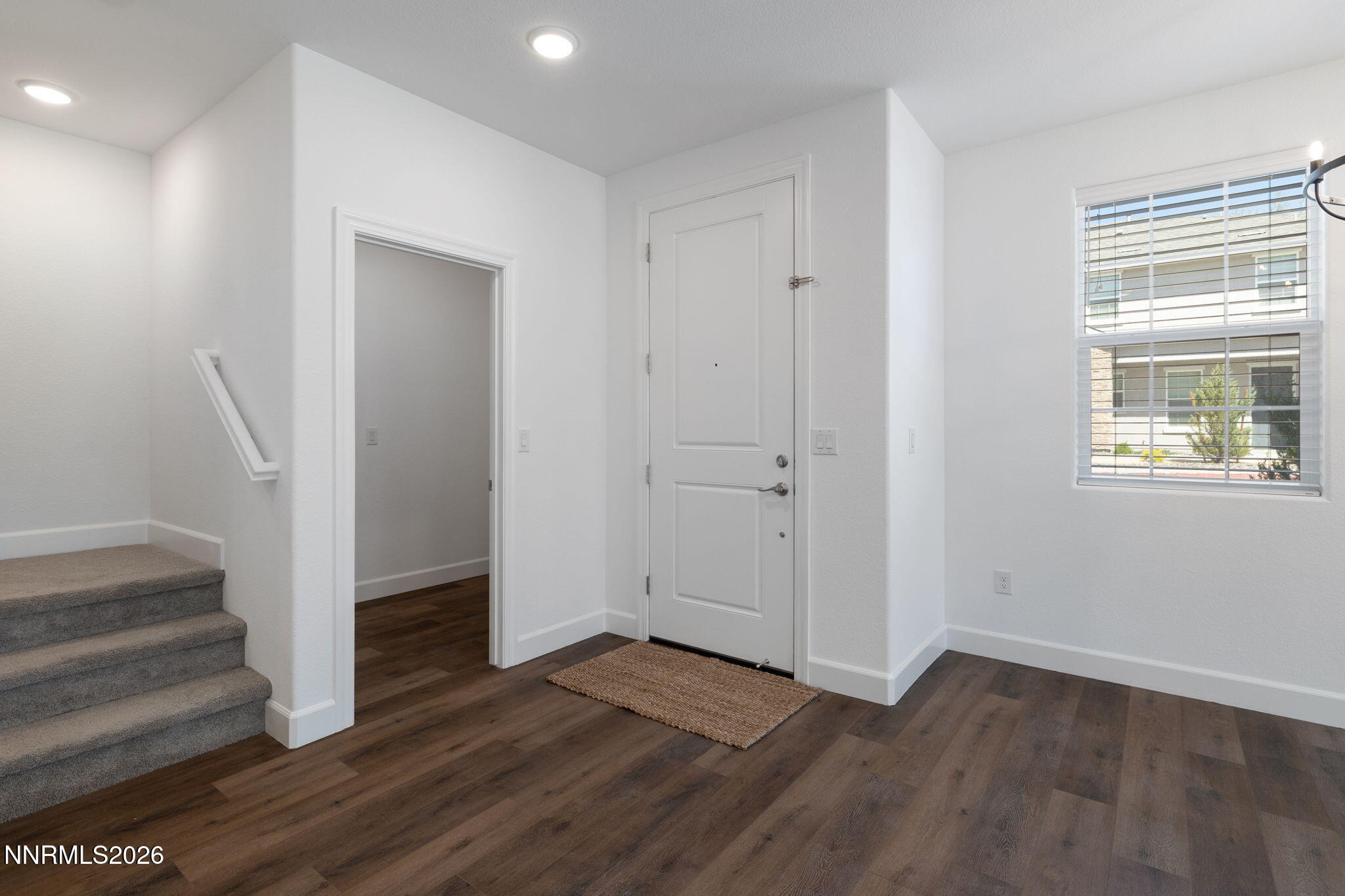 2010 Cradle Mountain Drive, Unit 3 Reno, NV 89523 - Photo 4 of 31 wooden floor in an empty room with a window