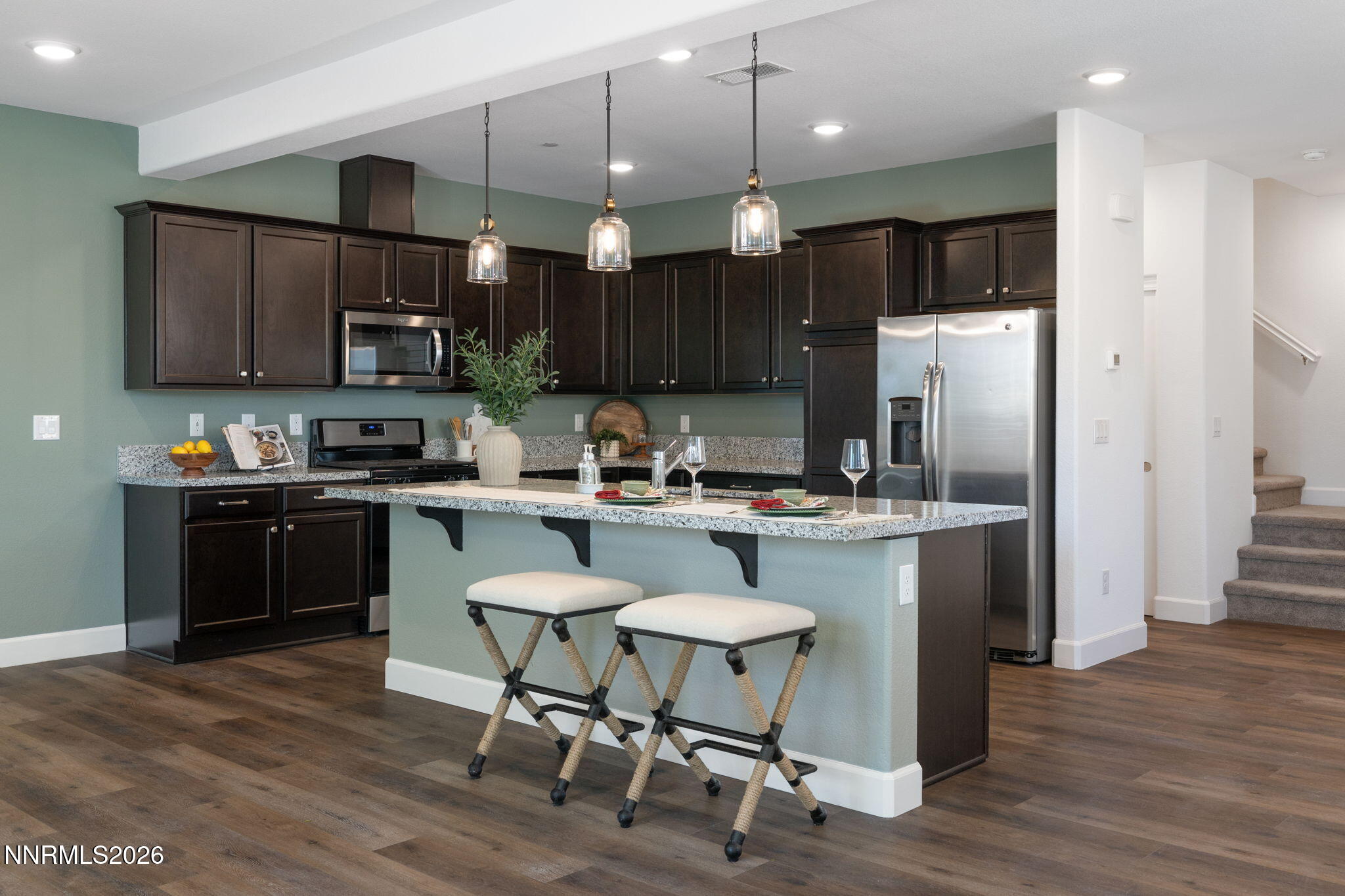 2010 Cradle Mountain Drive, Unit 3 Reno, NV 89523 - Photo 6 of 31 a kitchen with a refrigerator a sink and chairs