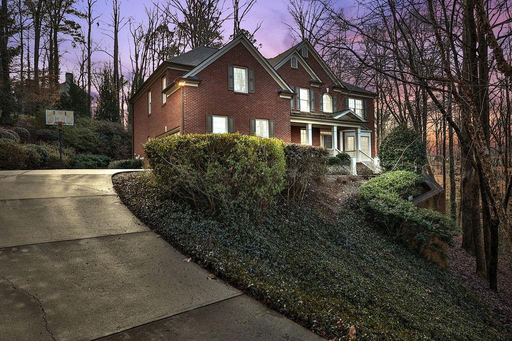 2060 Fife Ridge Court Roswell, GA 30075 - Photo 1 of 1 a front view of a house with a garden