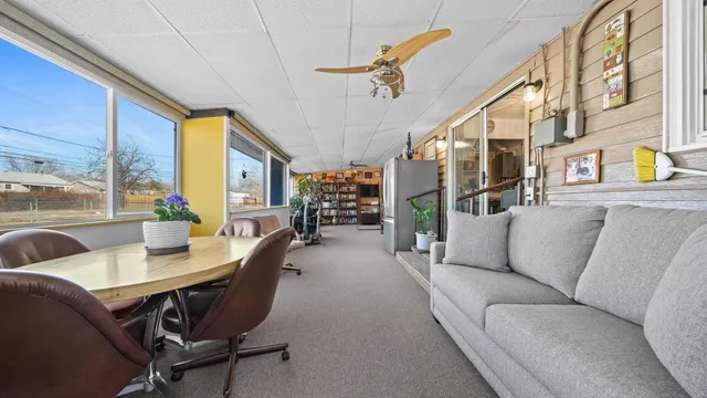 a living room with furniture and a table