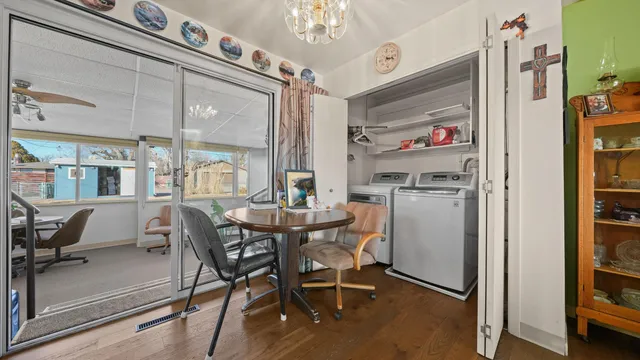 a dining room with furniture and window