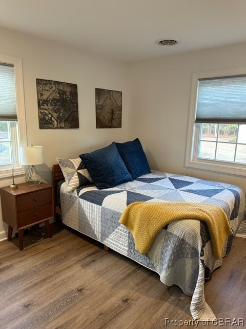 838 Lillys Neck Road Moon, VA 23119 - Photo 19 of 31 Bedroom featuring wood-type flooring