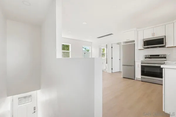 a view of a livingroom with a kitchen