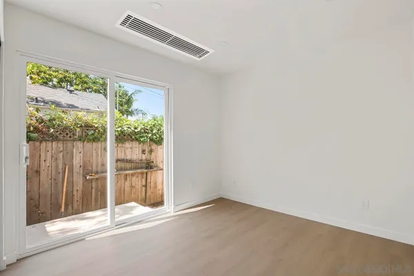 a view of empty room with floor to ceiling window