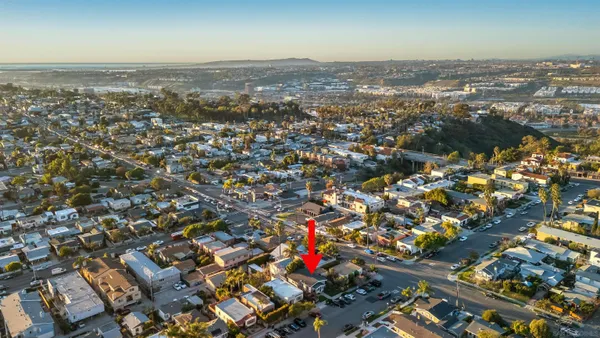 an aerial view of residential building with parking space