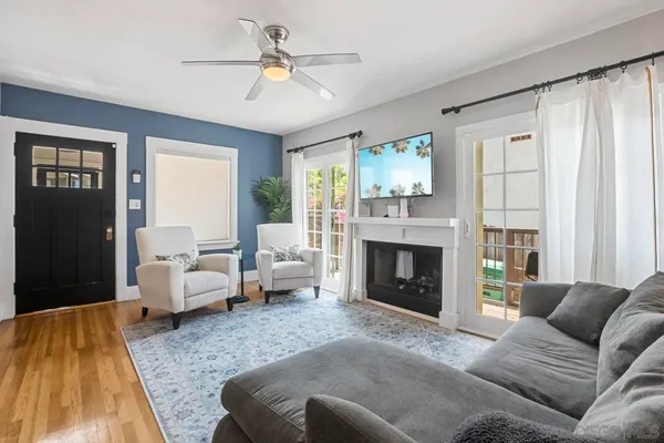 a living room with furniture and a fireplace